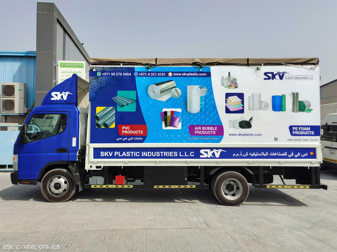 Branded truck with full-side vinyl wrap